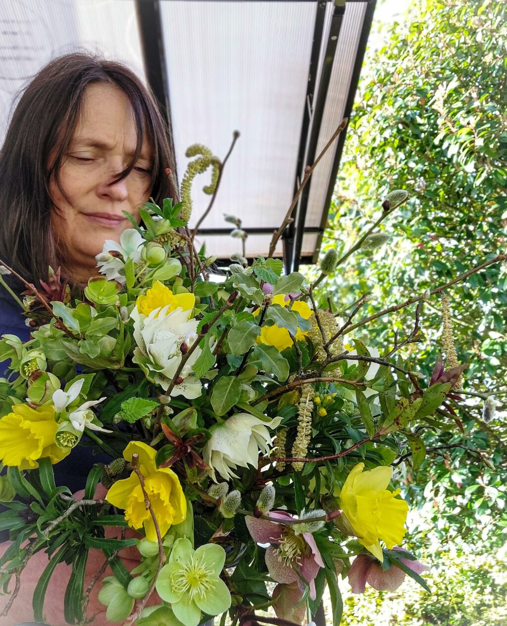 Kathryn Hurst holds a February bouquet made exclusively from season British flowers