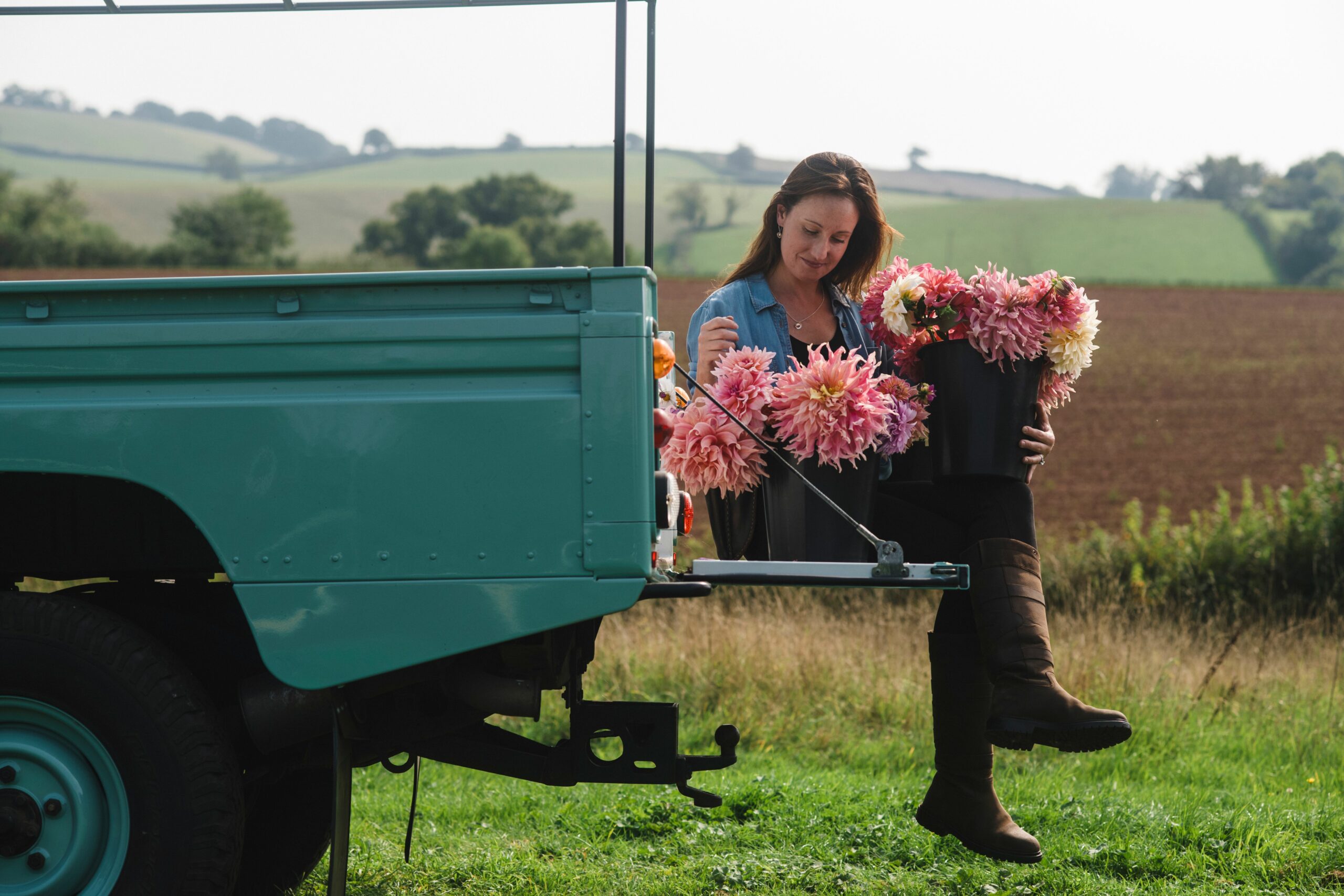 Amelia Cooper Smith with buckets of her stunning field grown dahlias