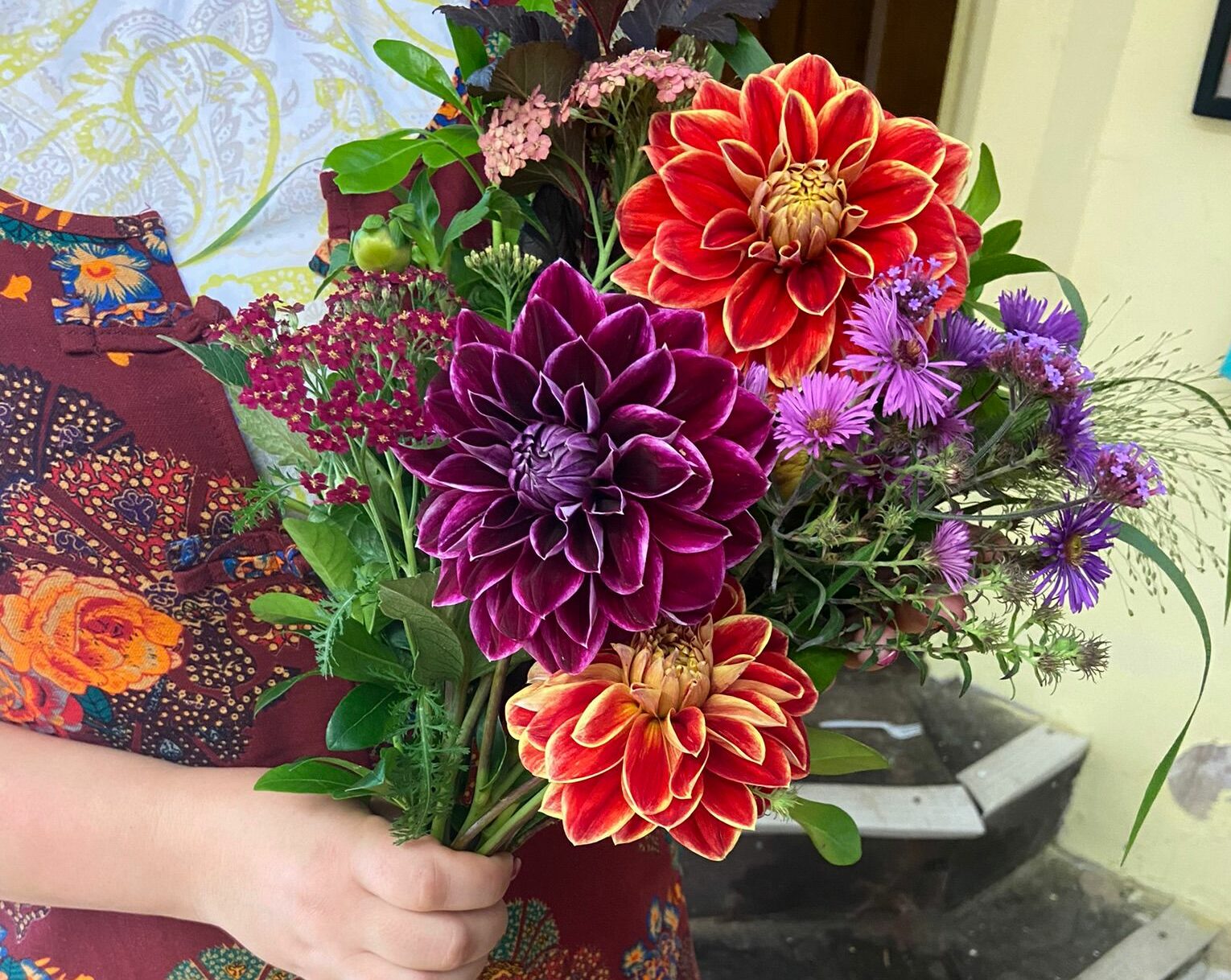 A late summer bouquet of dahlias, asters and grasses from the Bread and Roses floristry programme