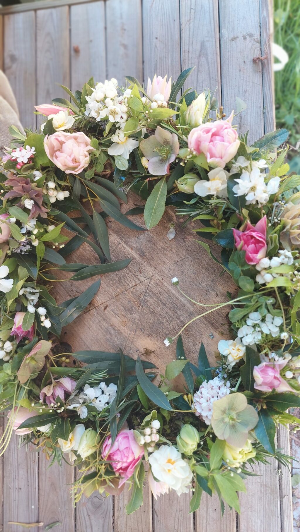 A biodegradable spring wreath. Natural funeral flowers by Camomile and Cornflowers, Worcestershire.