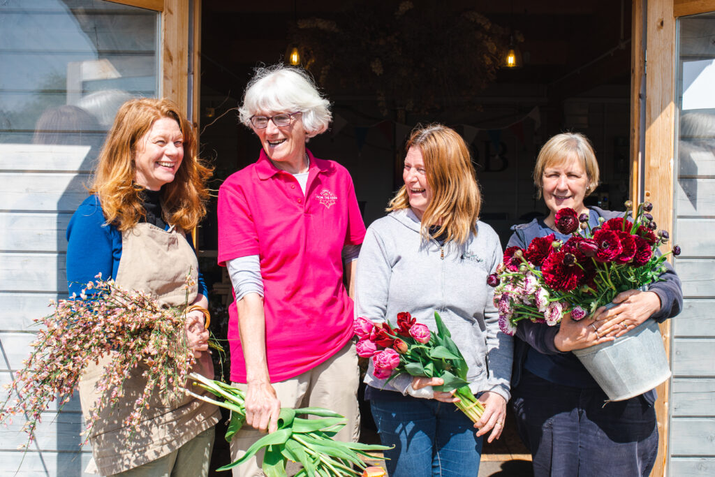 FFTF Honorary President Gill Hodgson of Field House Flowers, Co-chairs Jo Wright and Wendy Paul of Organic Blooms and Debbie Scott of East Lothian Flowers line up with armfuls of blooms for a photo call and laugh in the sunshine.