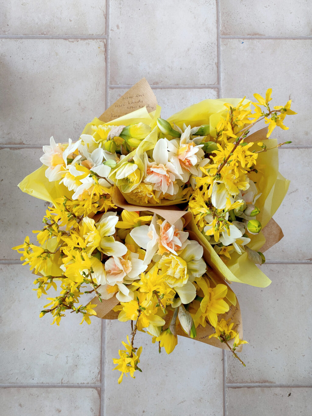 A collection of yellow easter posies with narcissi and forsythia by The Garden Gate Southwold.