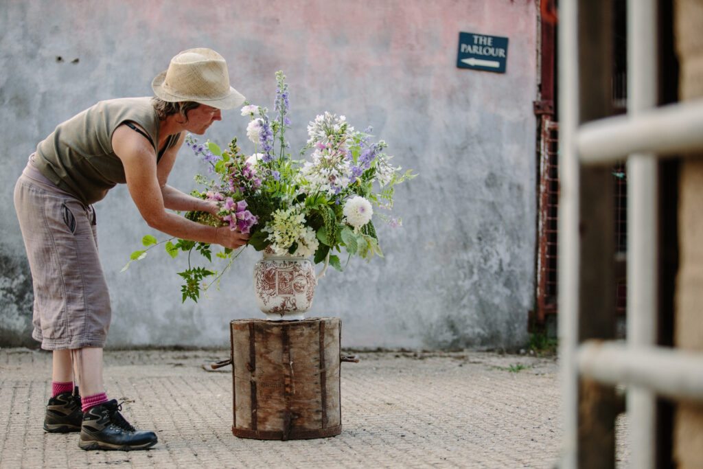 Rachel of Green and Gorgeous arranges freshly cut British flowers in a large ceramic urn.