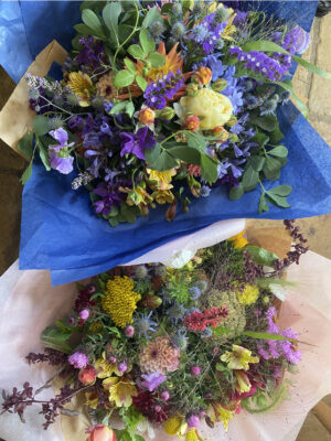 Blues and purples mingle with vibrant yellows in this late summer bouquet, wrapped in blue tissue, by The Ledbury Flower Farmer, Herefordshire.