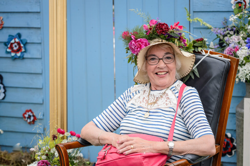 Visitors enjoying the flowery headgear for selfies at BBC Gardeners World Live. Photo: Jason Ingram