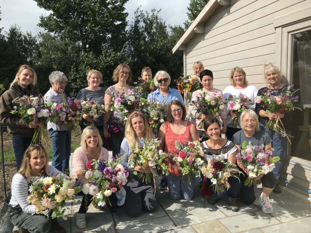 Visitors to Organic Blooms with the bouquets they have made during a Flower Farmers Big Weekend workshop