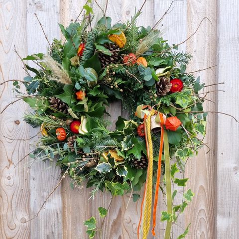 Pont y Twr Christmas wreath with touches of orange and wool with velvet ribbons