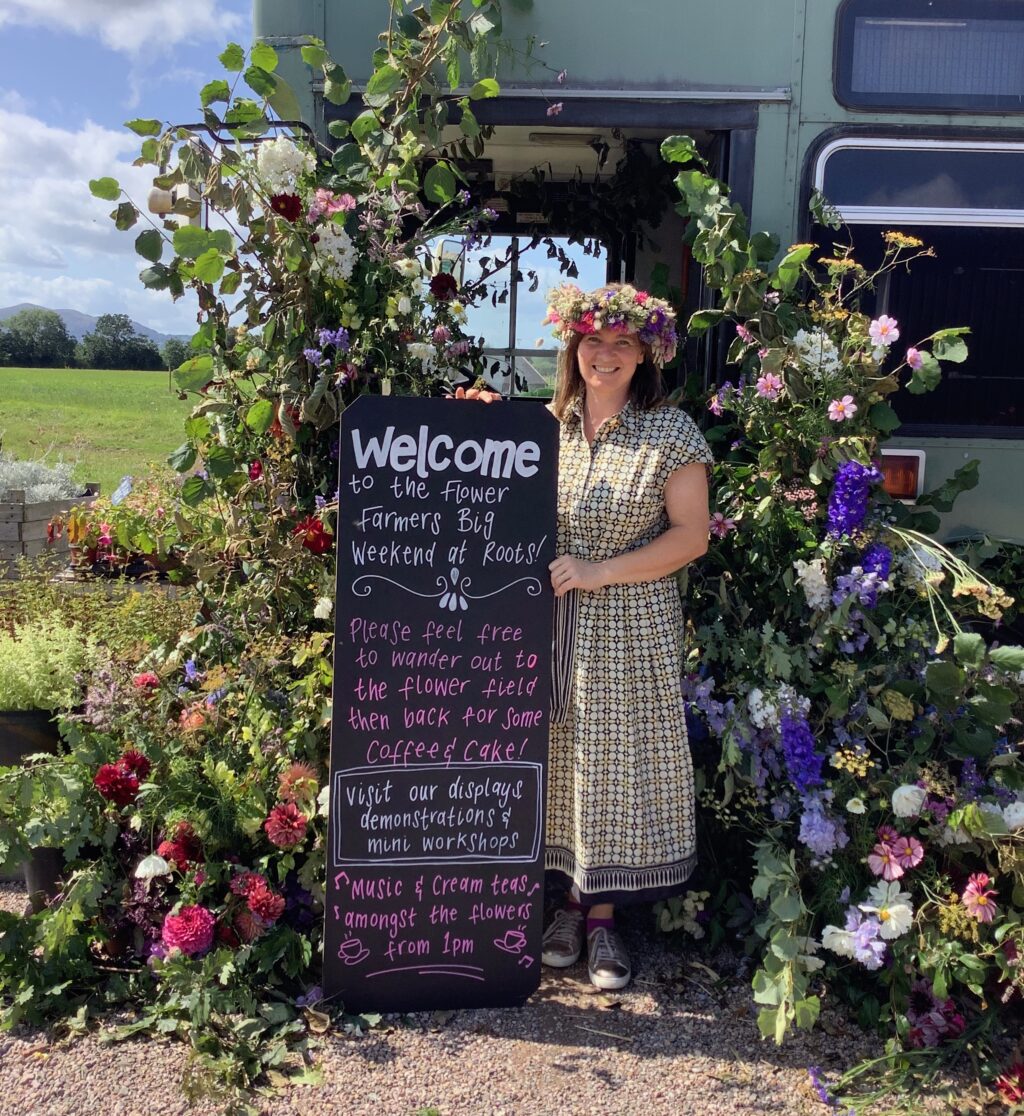the first Flower Farmers Big Weekend 2019 Meg Edmonds welcomes visitors in the West Midlands region standing amongst the floral decorations