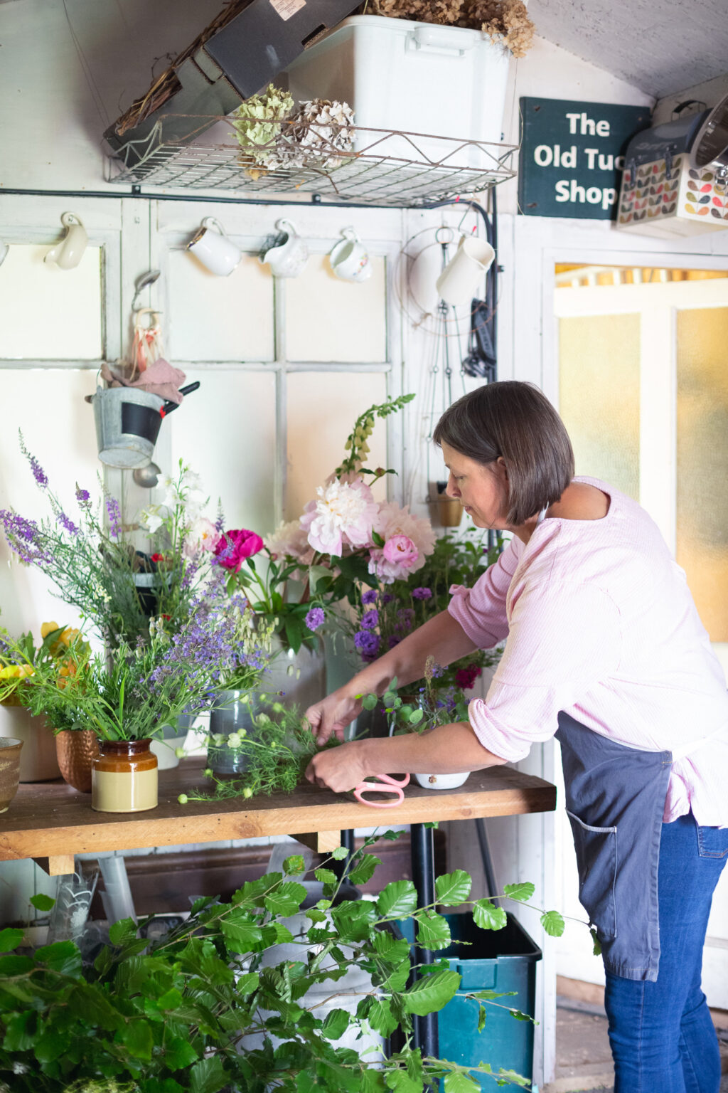 Carole of Tuckshop Flowers works from home in her garden workshop, making flowers for events, weddings and funerals.