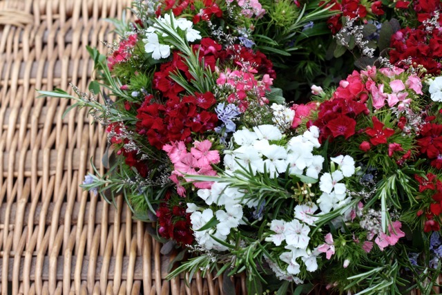 A funeral wreath with rosemary and sweet Williams by Tuckshop Flowers