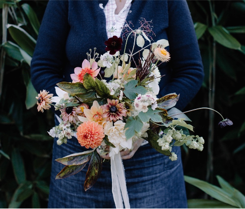 Queenie's Floral Design wedding bouquet for an autumn bride with dahlias and rudbeckias tied with silk ribbon