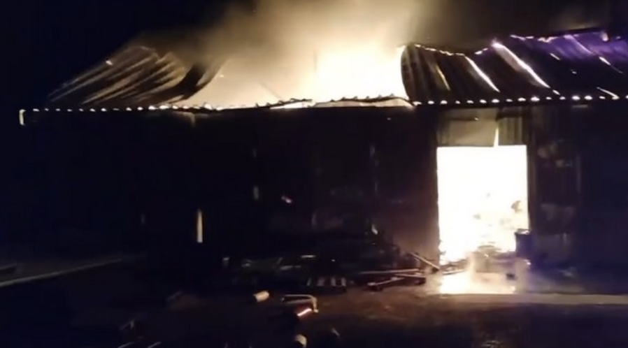 The machinery shed at Villa Verde ablaze after being hit by Russian fire